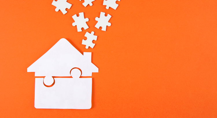 Graphic of a house made of puzzle pieces