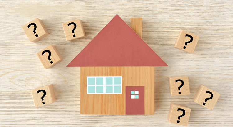 Graphic of a home surrounded by question marks