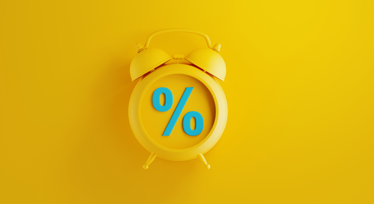 Clock with a percent sign on its face against a yellow background