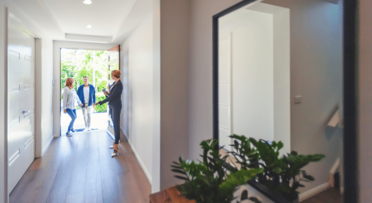 Realtor showing a couple a home