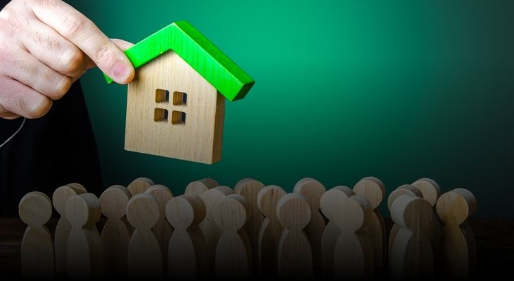 Graphic of a wooden house being held over a crowd of wooden people