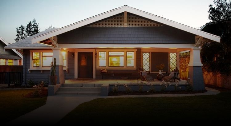 Photo of a house at twilight with interior lights on
