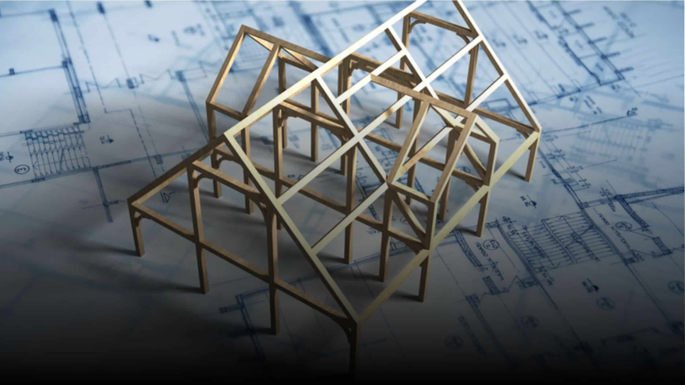 Small model of a framed home on top of a blueprint
