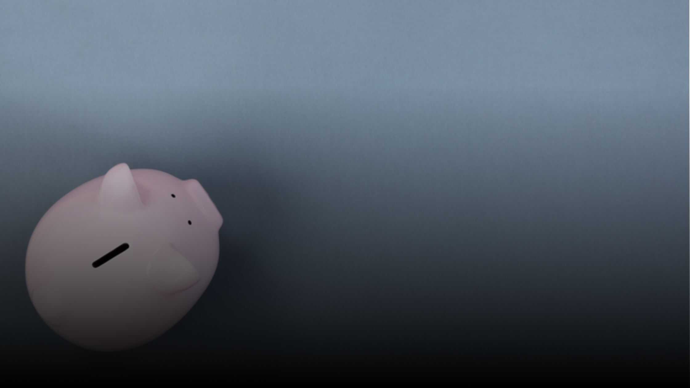 Photo of a piggy bank against a gray background