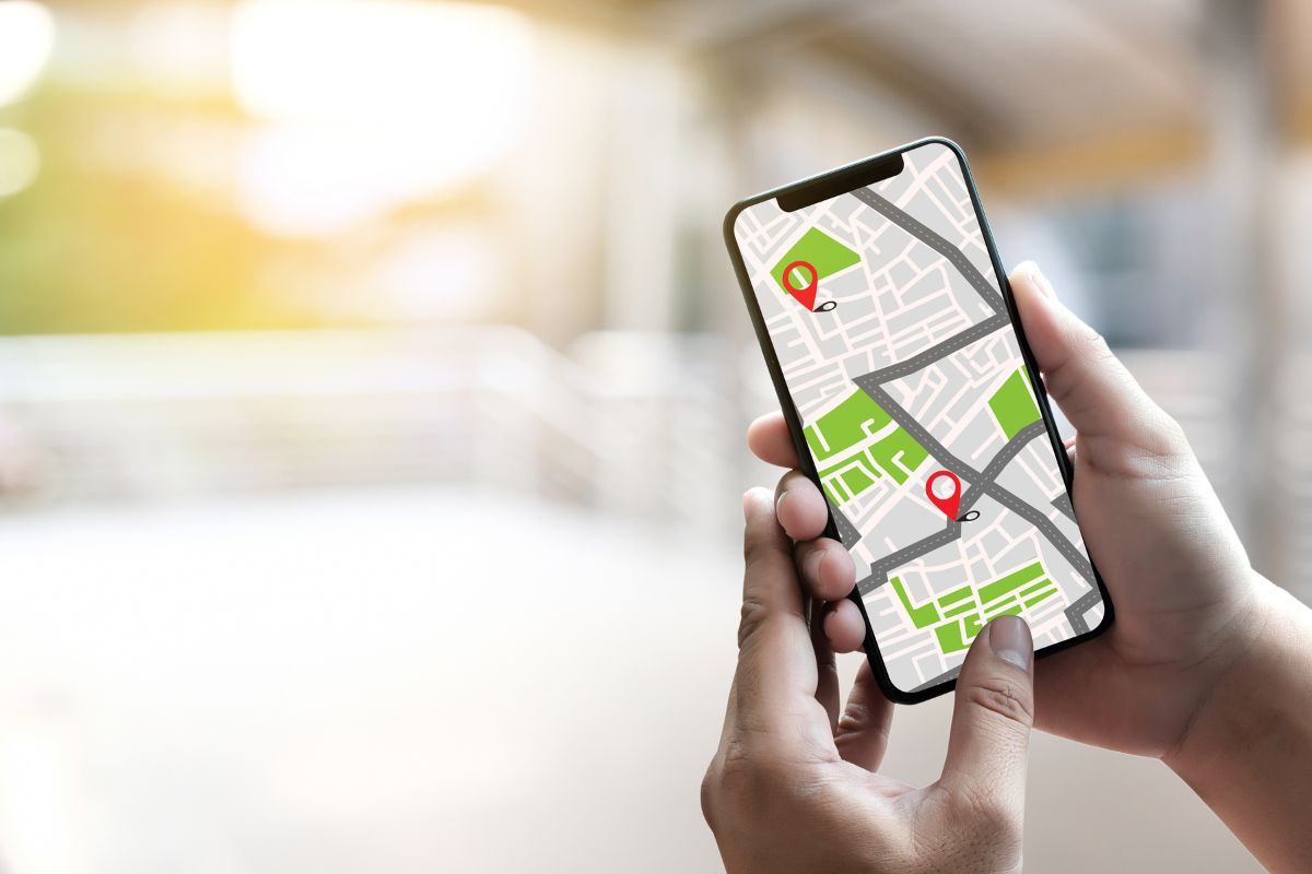 Buyer using a phone map to plan an open house route in Geneva, Batavia and St. Charles IL.