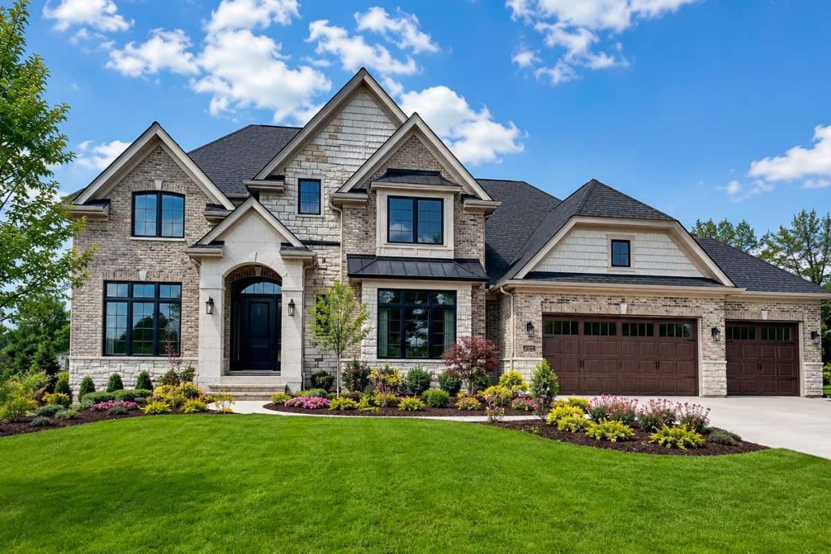Custom luxury home in Naperville IL with stone exterior, three-car garage and manicured lawn