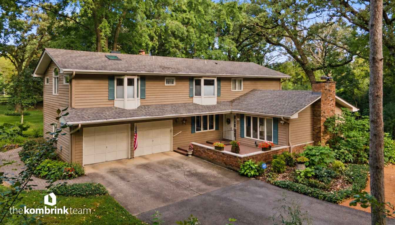 Brick and cedar two-story home at 2N962 Grand Monde Dr in Elburn, Illinois, on a landscaped 1.15-acre lot with mature trees
