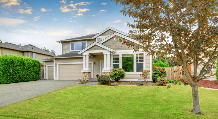 Suburban home with landscaped yard, representing homes still selling in a slower 2026 housing market.