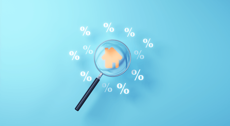 Magnifying glass over a home surrounded by mortgage rate percentage symbols